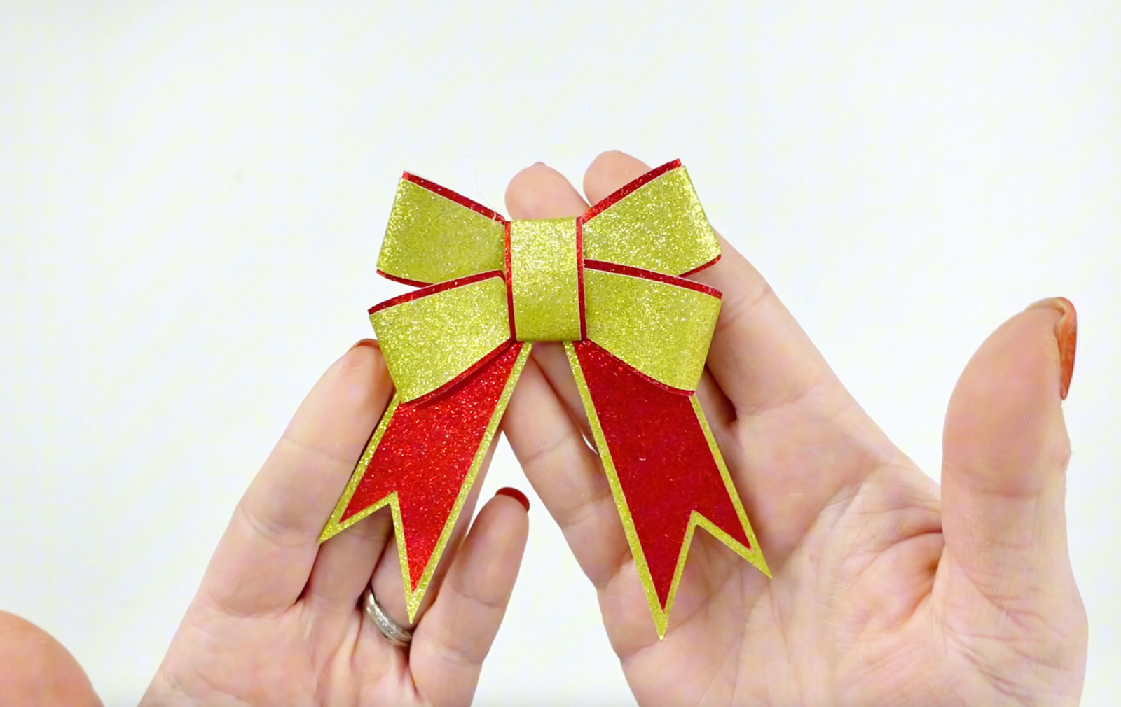 Red and gold glitter bow with free SVG download for Cricut. A two layered classic bow made out of cardstock. 